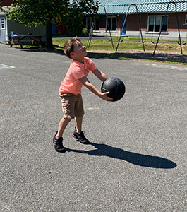 Little boy playing ball